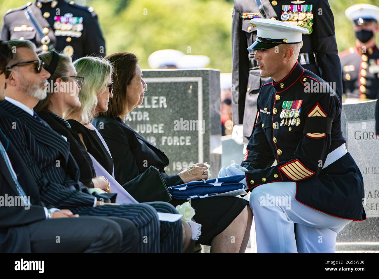 A U.S. Marine gives condolences to Jeanne Warner, wife of former U.S. Senator and Marine Corps 1st Lt. John Warner during his funeral in Arlington National Cemetery June 23, 2021 in Arlington, Virginia. Warner, a Senator for Virginia for 30-years and Secretary of the Navy died May 25th. Stock Photo
