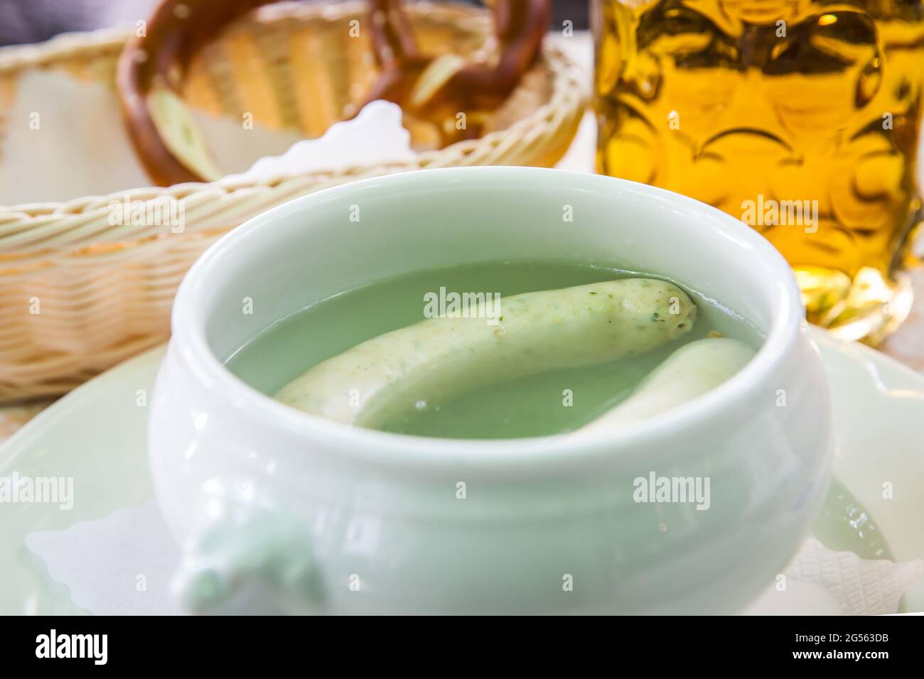 Bavarian cuisine - White munich sausages in pot Stock Photo