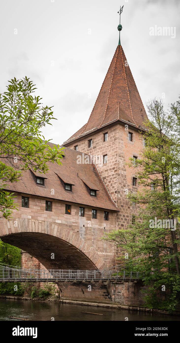 Medieval tower with bridge over river in the Old town of Nuremberg, German Stock Photo