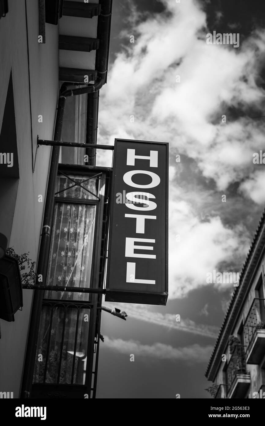 Hostel sign. Black and white urban photography Stock Photo