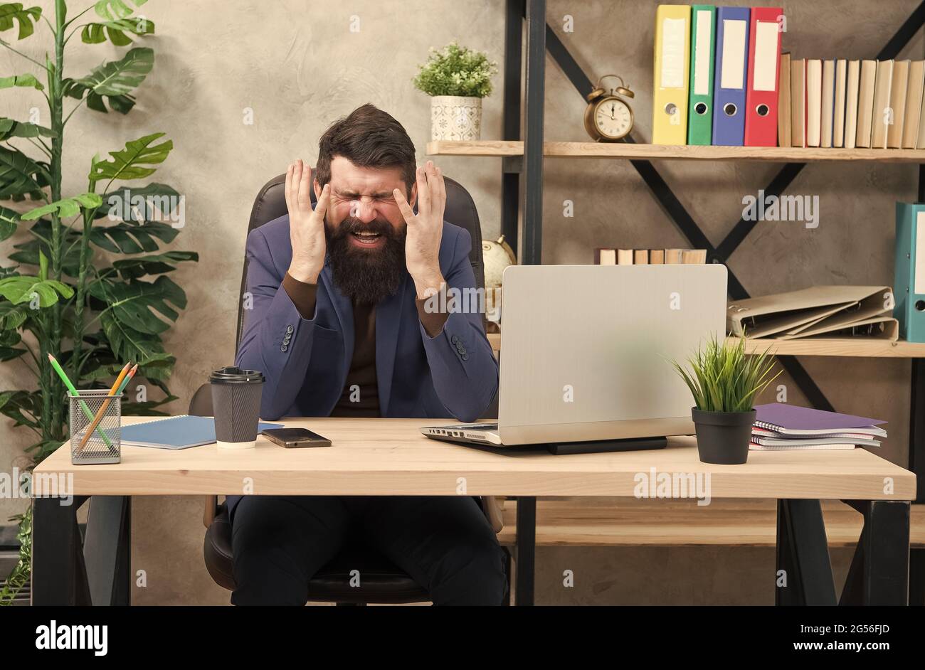 Hysterical weeping. Hysterical businessman weep in office. Bearded man fall into hysterics at workplace. Much work. Exhaustion and overwork. Fatigue Stock Photo