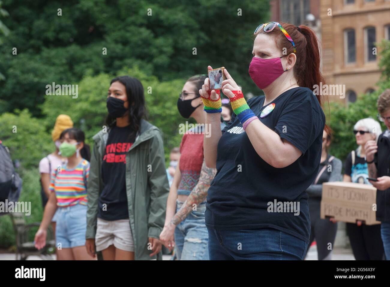 A protester recording the event with her smartphone, during the demonstration.Transgender rights advocates stood outside of the Ohio Statehouse at noon to oppose and bring attention to an amendment to a bill that would ban transgender women from participating in high school and college women sports. The original bill that this transgender ban was added to dealt with compensation for college students to profit off of their name, image and likeness. The addition of transgender ban to this bill was a surprise, because a transgender ban bill already is in existence. (Photo by Stephen Zenner/SOPA Stock Photo