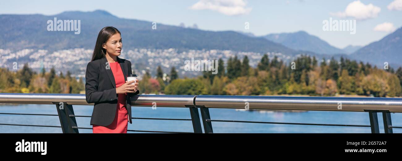 Asian canadian businesswoman drinking coffee during office break. Professional business woman portrait. Panoramic banner. Urban life in Coal Harbour Stock Photo
