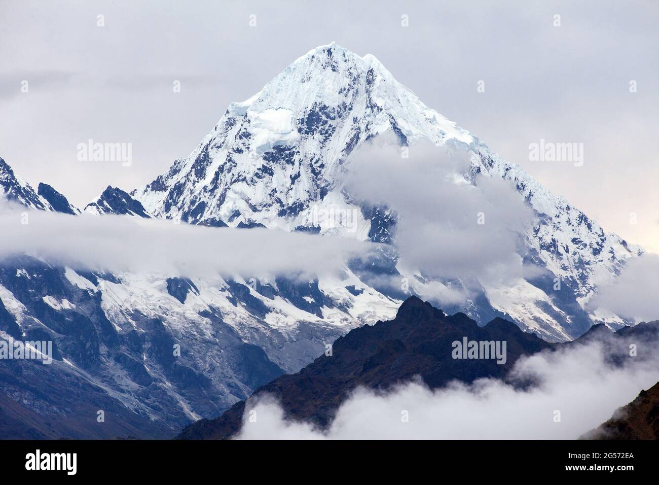 Mount Salkantay in the middle of clouds, view from Choquequirao trekking trail, Cuzco area, Machu Picchu area, Peruvian Andes Stock Photo