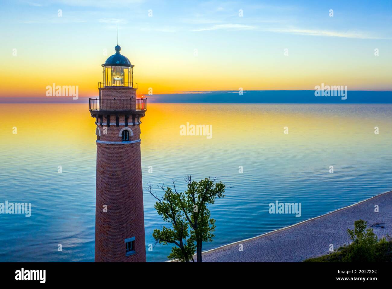 Aerial sunset view of Little Sable Point Lighthouse, located on Lake Michigan near Silver Lake State Park and Mears in Benona Township, Michigan Stock Photo