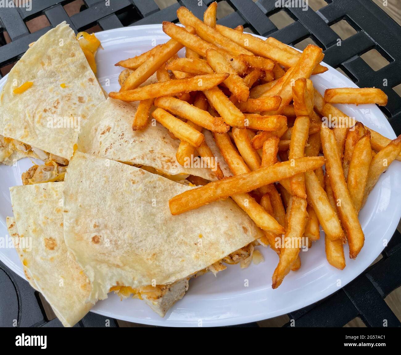 Mexican style chicken quesadilla with fries Stock Photo Alamy