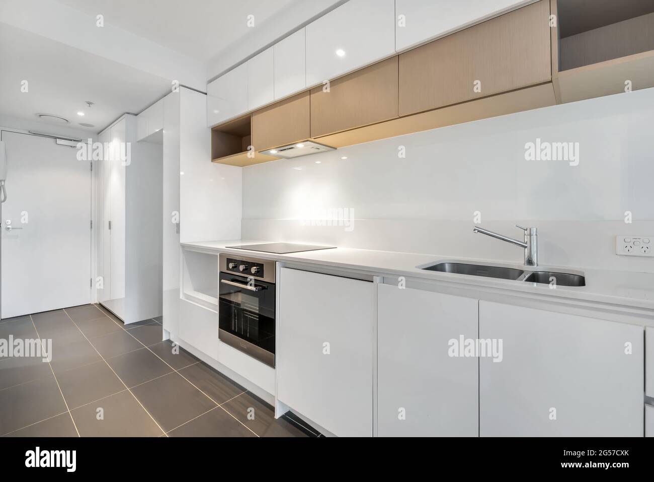 Kitchen with white and wooden furniture Stock Photo - Alamy