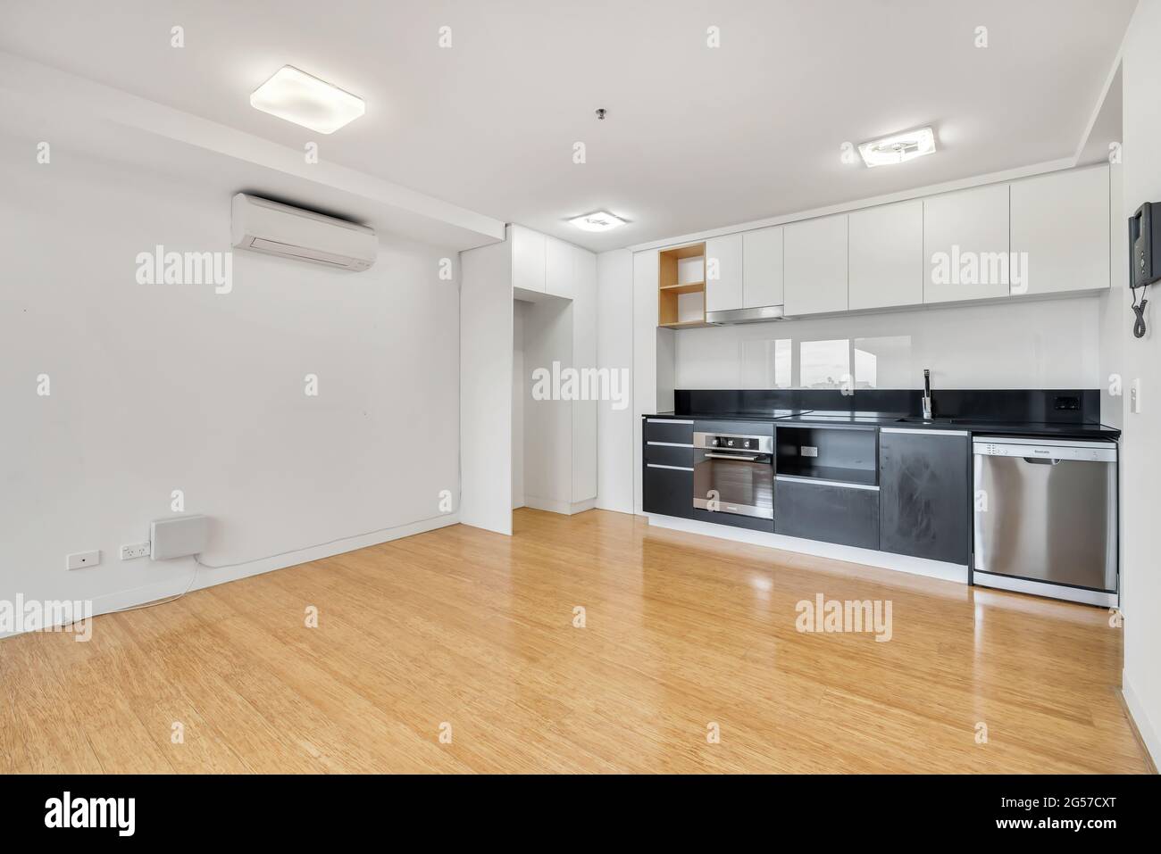Kitchen with white and black furniture Stock Photo - Alamy