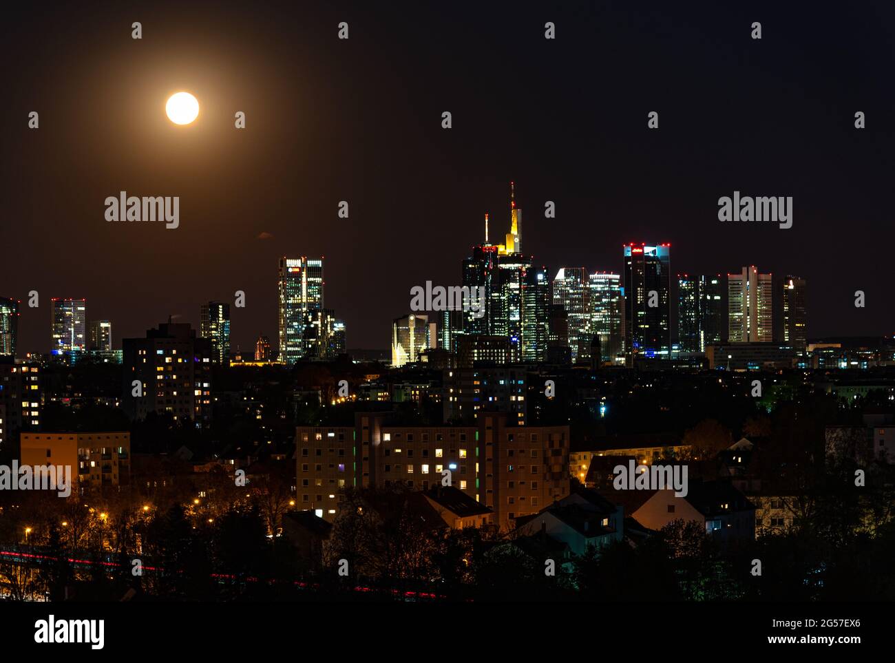 Beautiful view on  Frankfurt am Main (european finance center city) downtown skyline cityscape. Moon, supermoon during twilight blue hour, sunset, eve Stock Photo