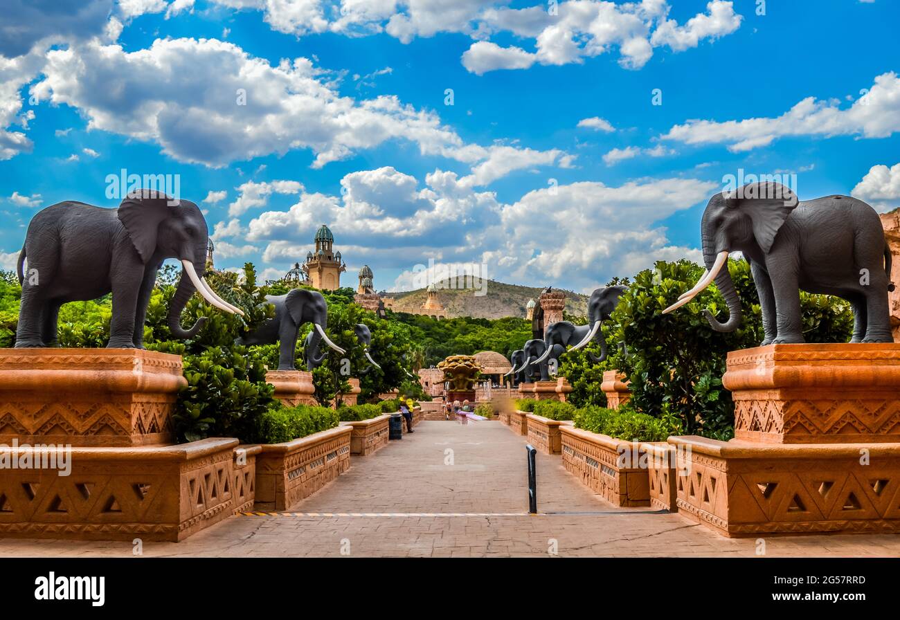 Entrance of The Palace / Lost City /Sun City with stone statues under blue sky Stock Photo