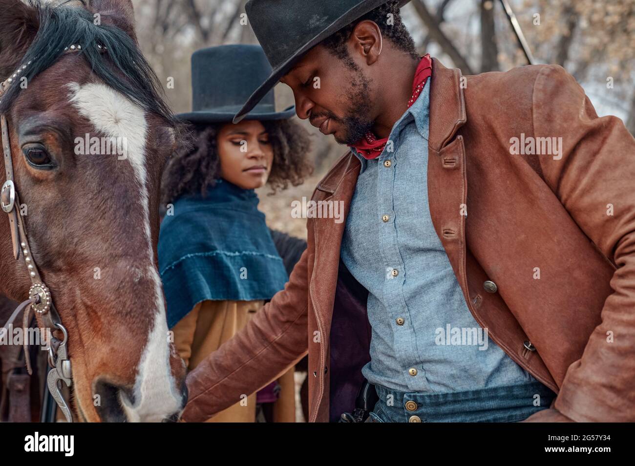 RELEASE DATE: 2021 TITLE: The Harder They Fall STUDIO: Netflix DIRECTOR: Jeymes Samuel PLOT: When an outlaw discovers his enemy is being released from prison, he reunites his gang to seek revenge in this Western. STARRING: ZAZIE BEETZ, JONATHAN MAJORS as Nat Love. (Credit Image: © Netflix/Entertainment Pictures) Stock Photo