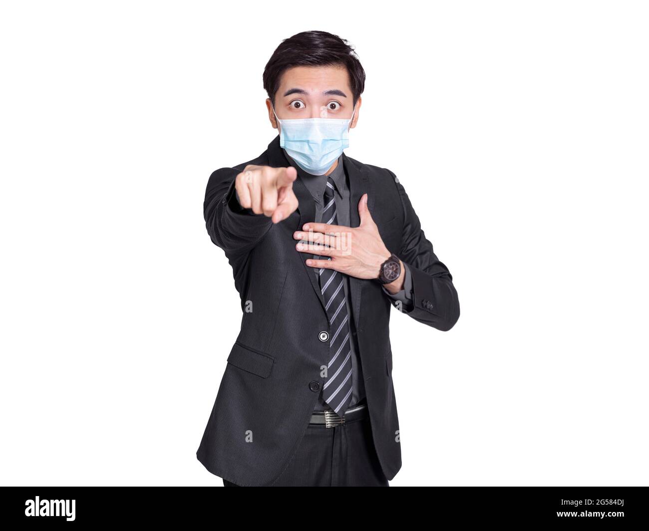 Businessman wearing face protective medical mask for protection from virus disease pointing finger to camera Stock Photo