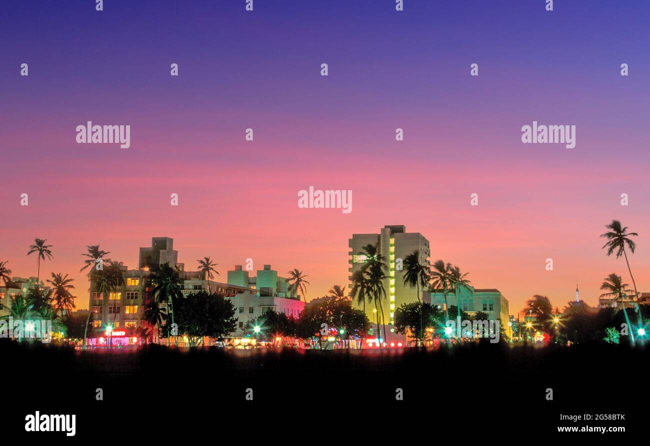 USA, Florida, Miami Beach, South Beach, Illuminated city skyline at sunset Stock Photo