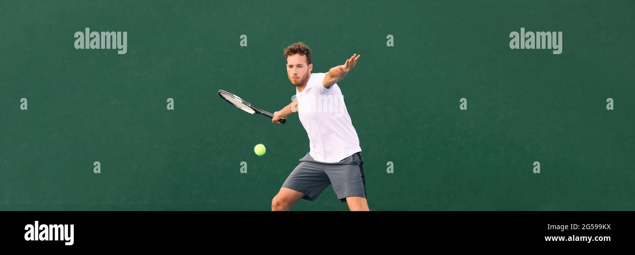 Tennis player man hitting ball with forehand hit on outdoor court playing game. Male sports athlete working out cardio traning. Panorama banner on Stock Photo