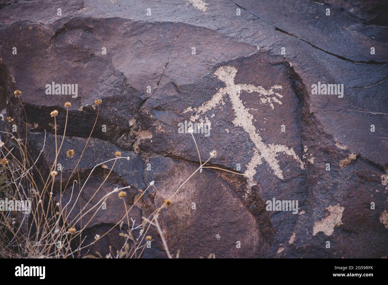 Rock drawing, or petroglyph, appears on stone in Nevada desert canyon. Created by native Americans Stock Photo