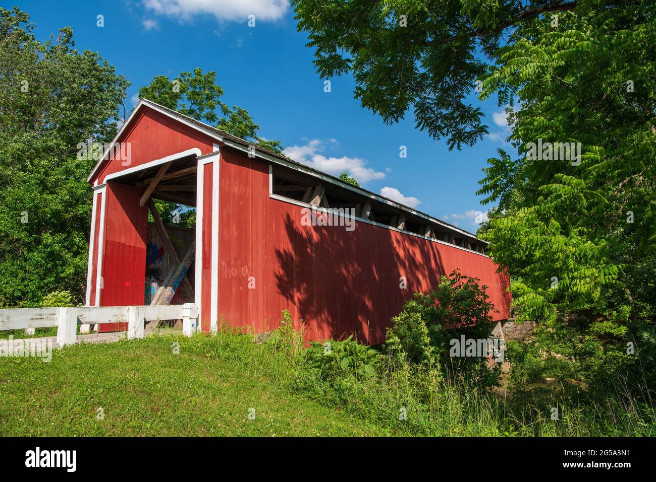 Stockheughter Covered Bridge, also known as Enochsburg Covered Bridge, is a historic Howe Truss covered bridge over Salt Creek, located in Ray Townshi Stock Photo