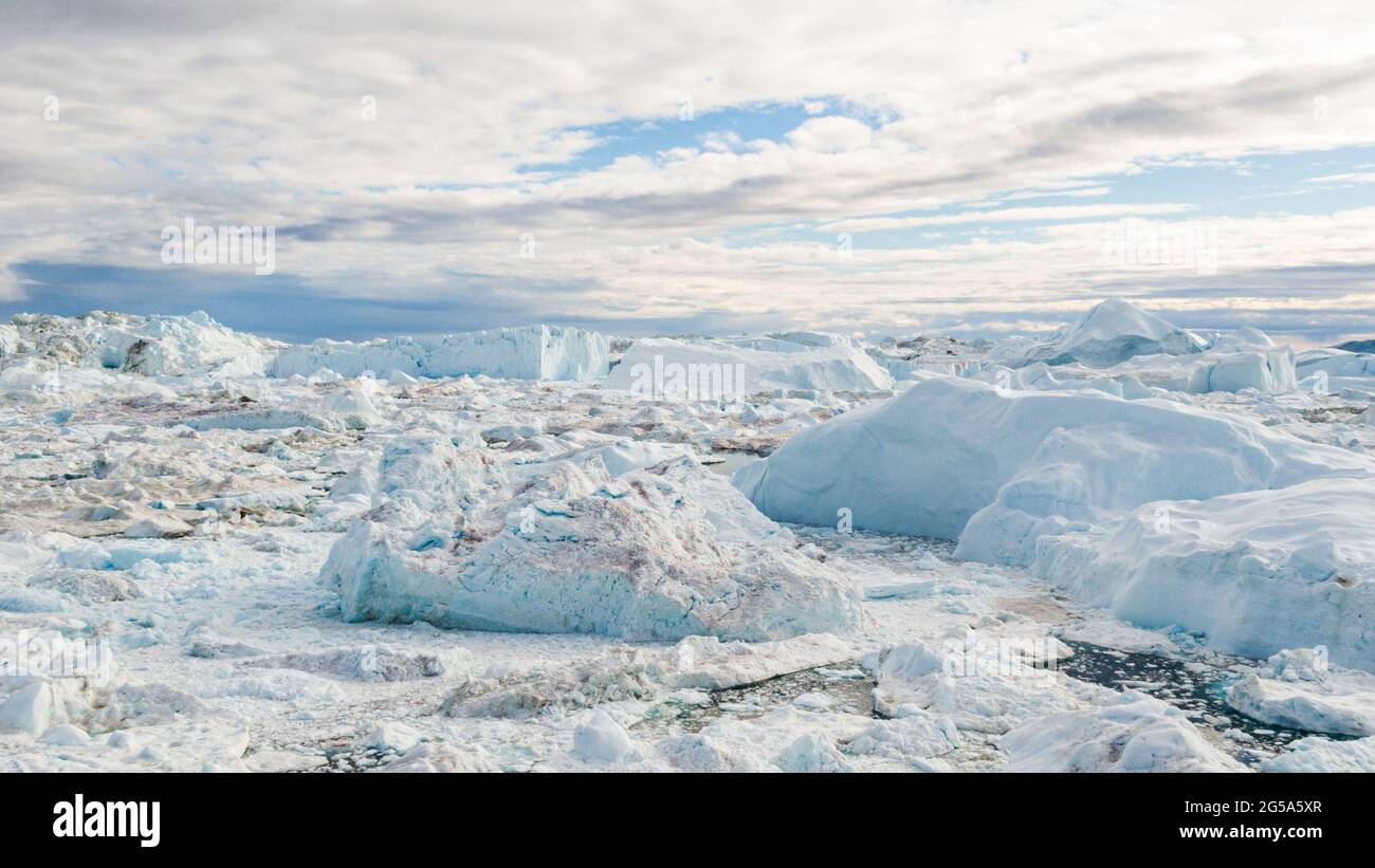 Drone image of Icebergs and ice from glacier in nature landscape Greenland Stock Photo