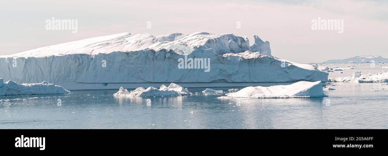 Global Warming and Climate Change - Icebergs from melting glacier in icefjord Stock Photo