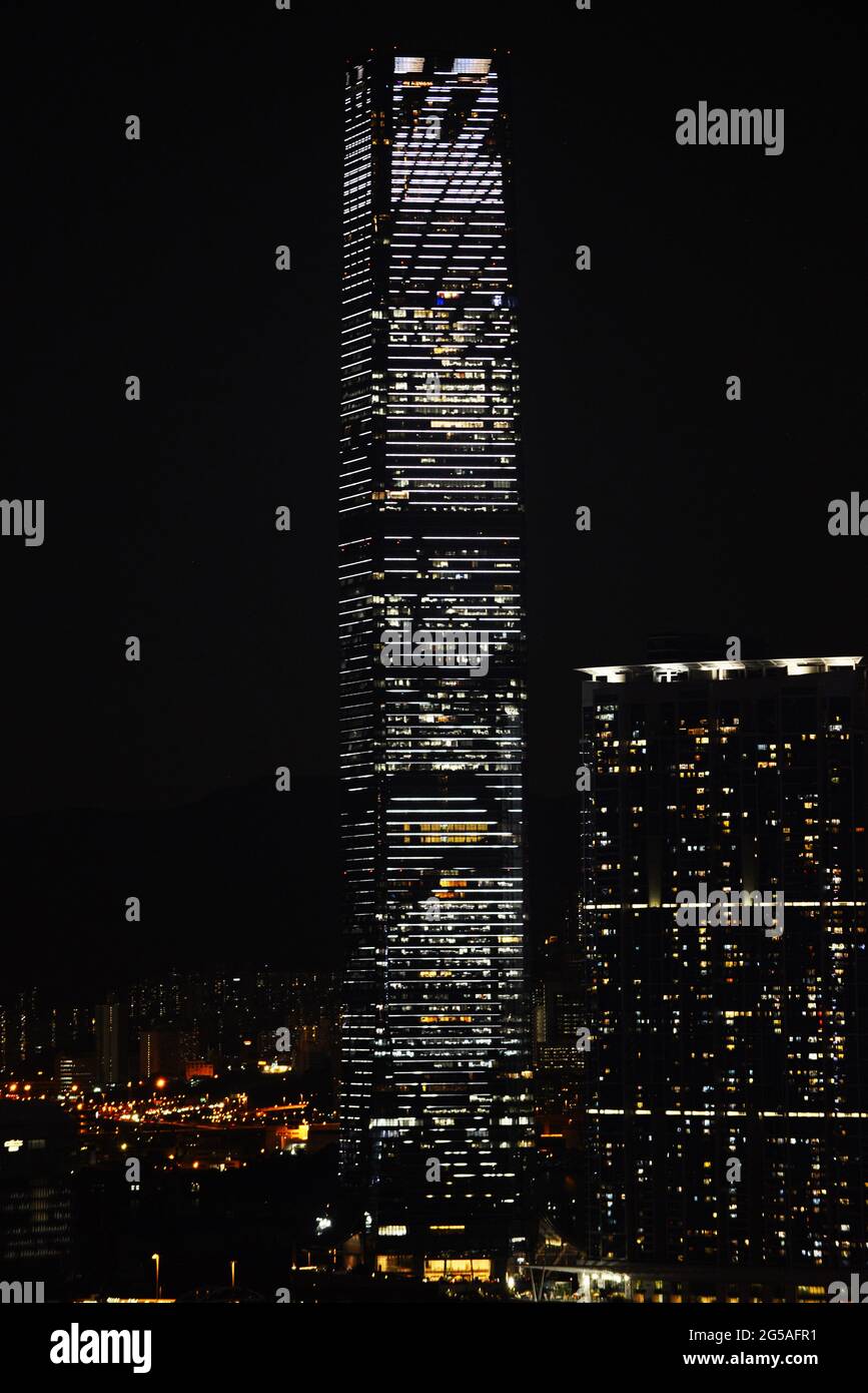 Illuminated ICC Tower in Hong Kong. Stock Photo