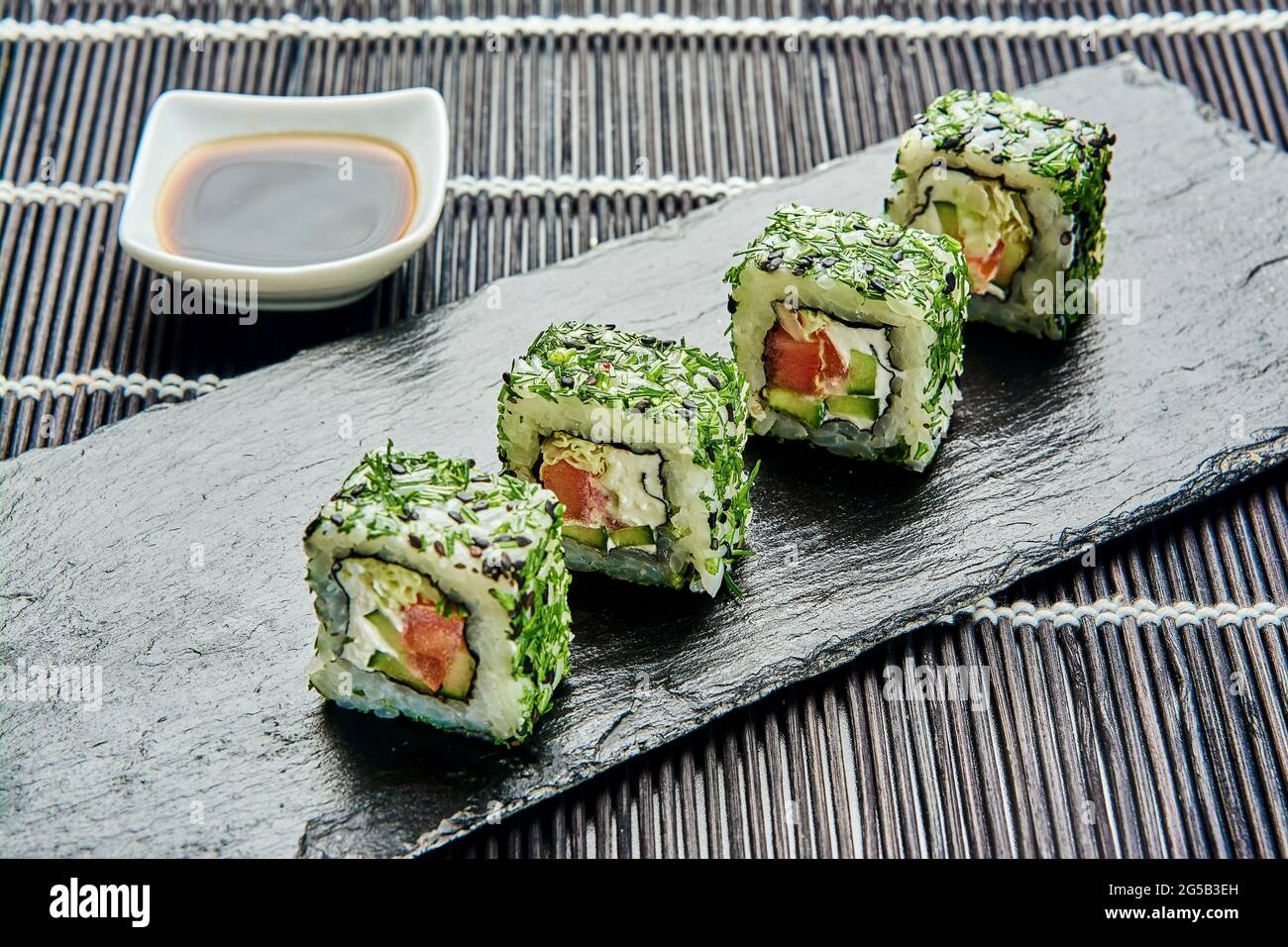 Rolls with cucumber, tomato, cream cheese, dill, cabbage and sesame on