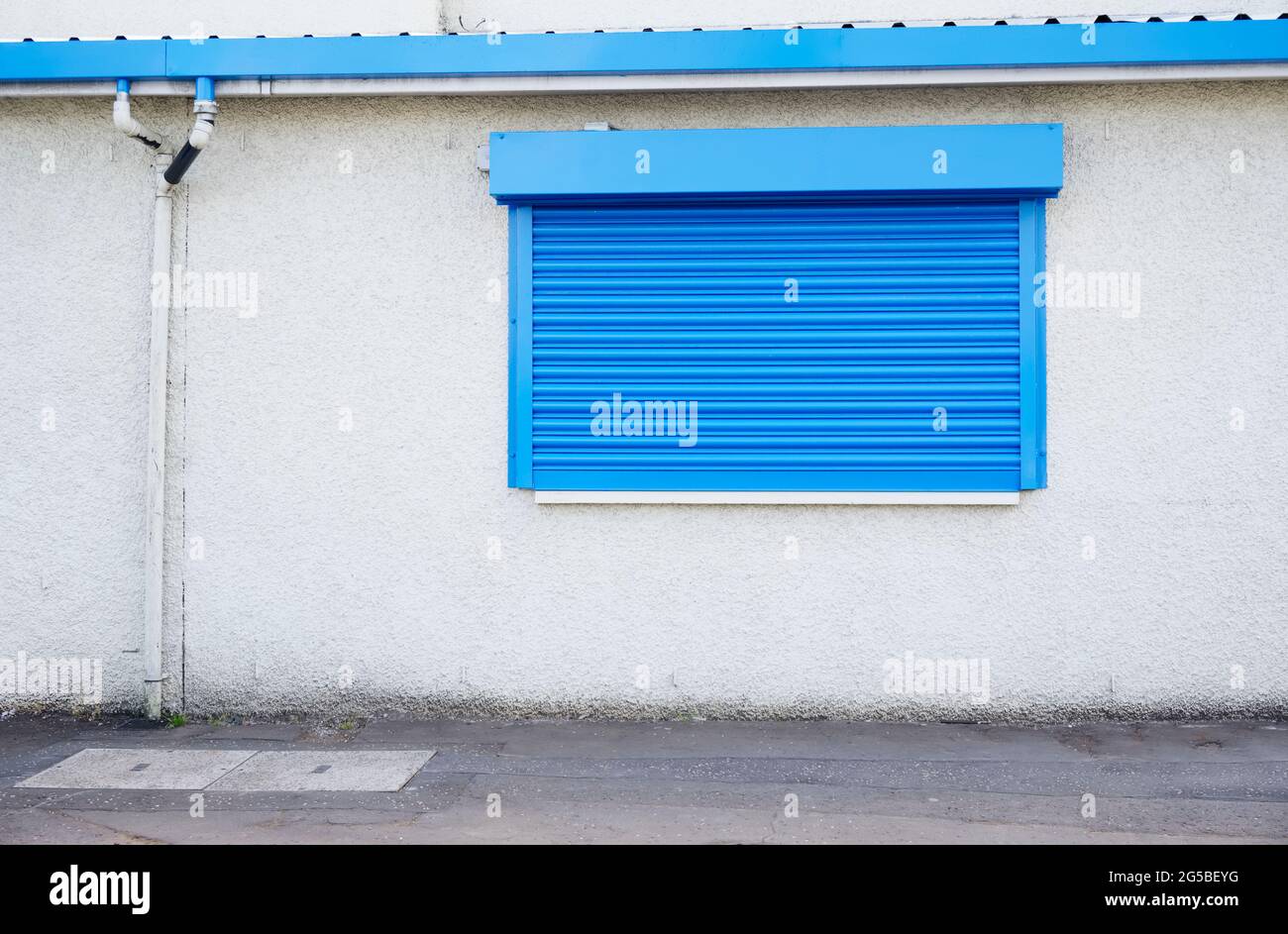 Shop front with blank sign and closed shutter door Stock Photo - Alamy