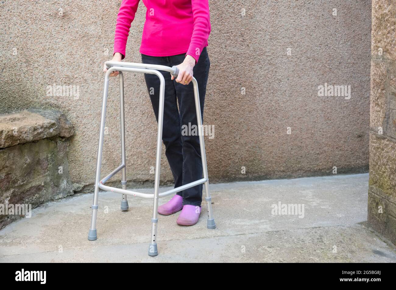 Old lady and zimmer frame hi-res stock photography and images - Alamy
