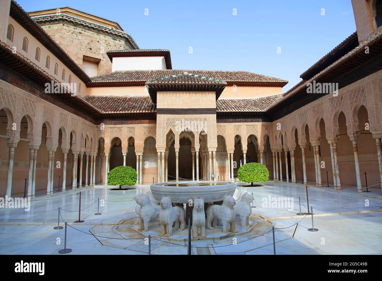 The Patio of the Lions (Patio de los Leones) the most famous place of the Alhambra in Granada.On top of the hill al-Sabika,on the bank of the river Darro,Granada Spain.Constructed as a fortress in 889 CE.,then largely ignored.Rebuilt mid-13th century by Arab Nasrid emir Mohammed ben Al-Ahmar of the Emirate of Granada,After the Christian Reconquista in 1492,the site became the Royal Court of Ferdinand and Isabella. Stock Photo