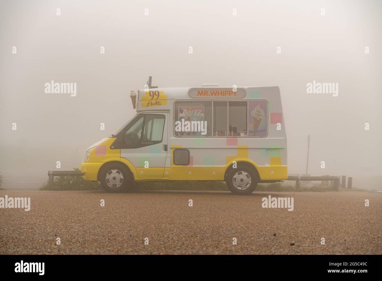 An ice cream van in fog, rain and bad weather Stock Photo