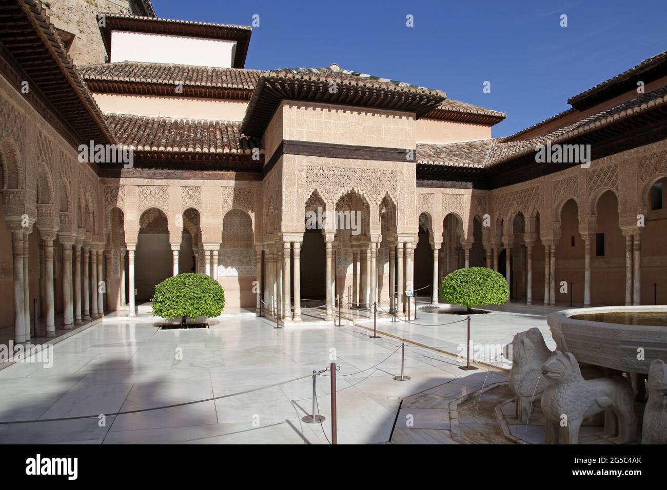 The Patio of the Lions (Patio de los Leones) the most famous place of the Alhambra in Granada.On top of the hill al-Sabika,on the bank of the river Darro,Granada Spain.Constructed as a fortress in 889 CE.,then largely ignored.Rebuilt mid-13th century by Arab Nasrid emir Mohammed ben Al-Ahmar of the Emirate of Granada,After the Christian Reconquista in 1492,the site became the Royal Court of Ferdinand and Isabella. Stock Photo