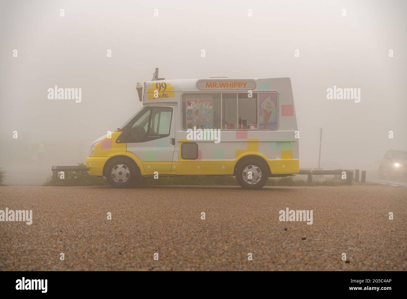 An ice cream van in fog, rain and bad weather Stock Photo