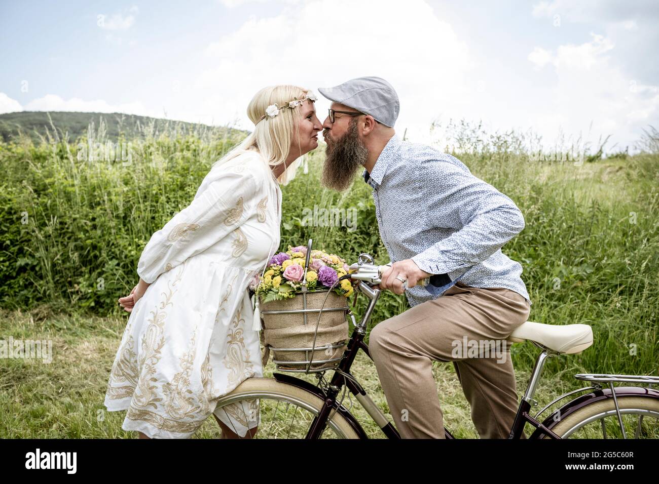 Happy Valentines Love Story Concept Of A Romantic Couple Against Chalk  Drawings Background. Male Riding His Girlfriend In A Front Bicycle Basket.  Stock Photo, Picture and Royalty Free Image. Image 40366145.