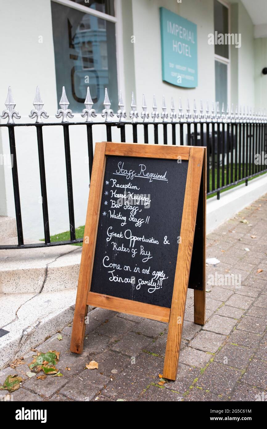staff wanted, vacancies, we are hiring, we are recruiting, jobs available...job vacancy signs in Welsh holiday resort Tenby, Pembrokeshire Stock Photo