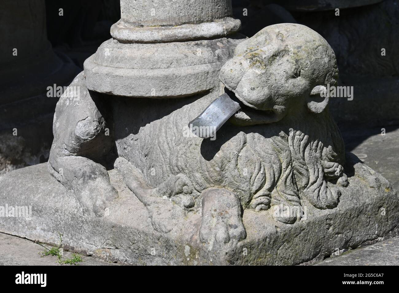 Base figure with tongue out at a renaissance fountain in front of the castle in Bückeburg Stock Photo
