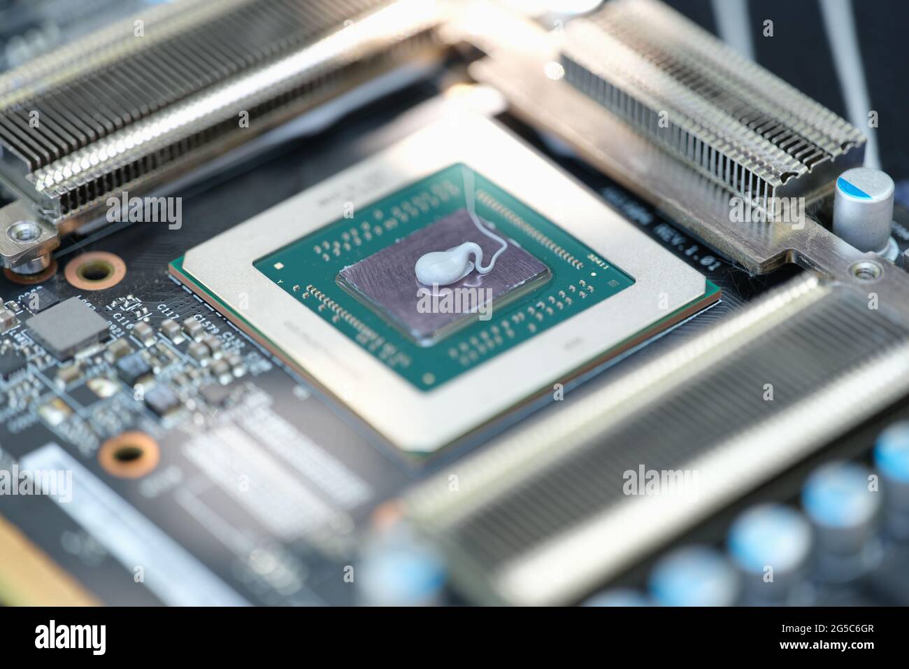 Thermal paste lying on microchip for video card closeup Stock Photo