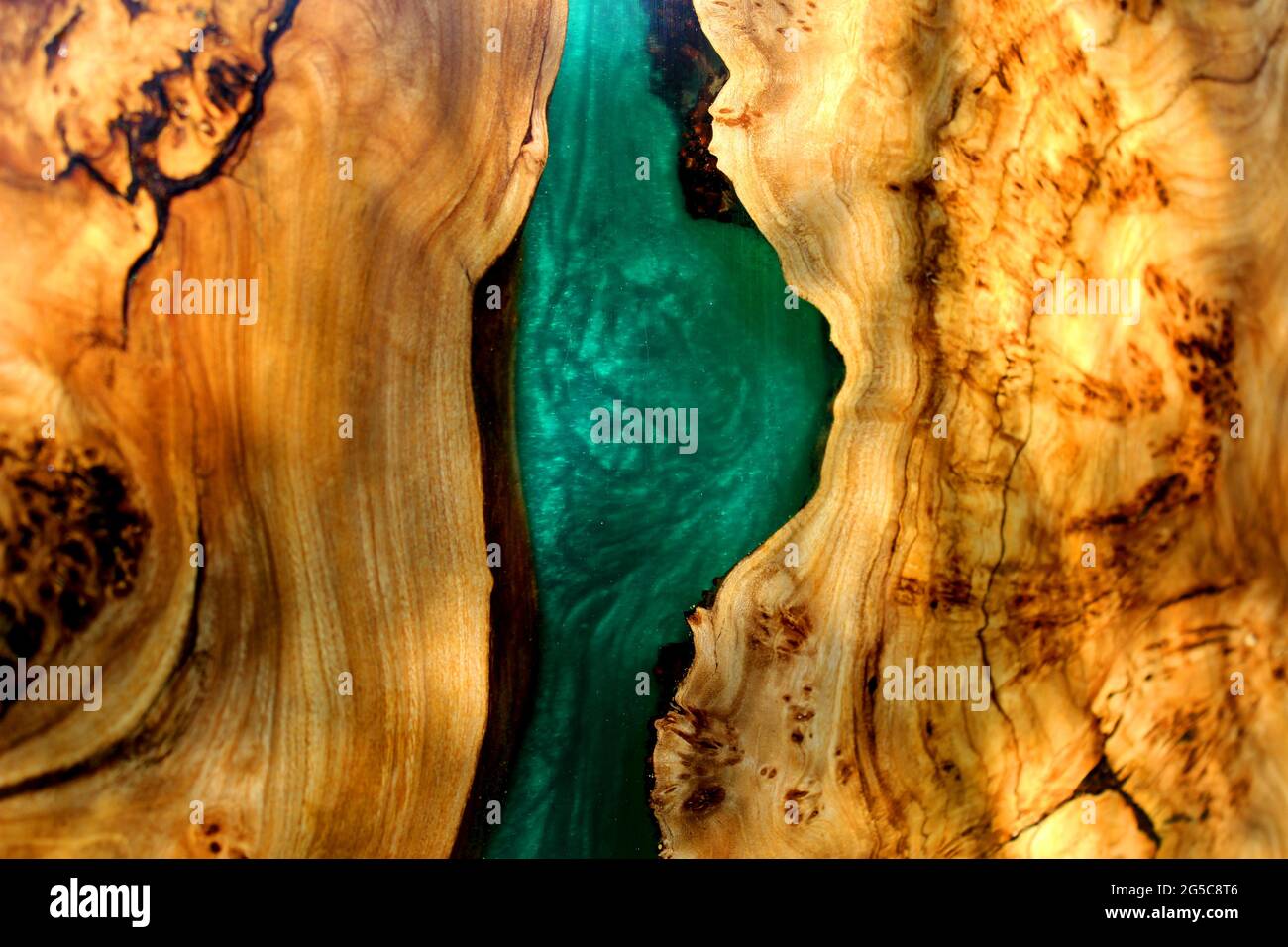 turquoise epoxy resin panel with walnut, texture for design. Stock Photo