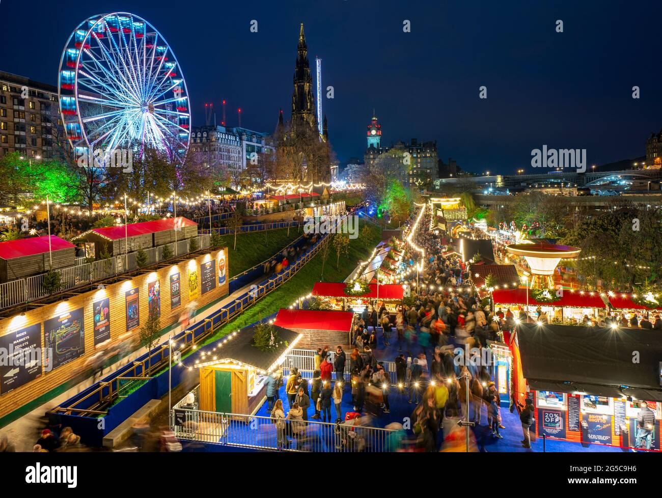 Night view of the opening evening of the annual Edinburgh Christmas Market in East Princes Street Gardens, Edinburgh, Scotland, UK Stock Photo