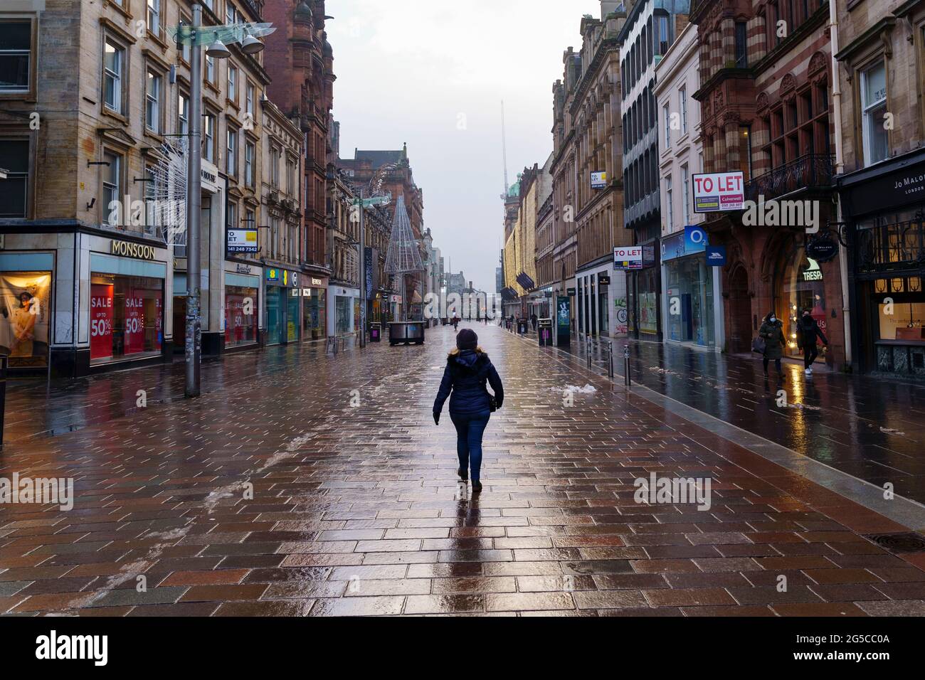 Empty Buchanan Street with solitary person during the national Covid-19 lockdown, Glasgow, Scotland, UK Stock Photo