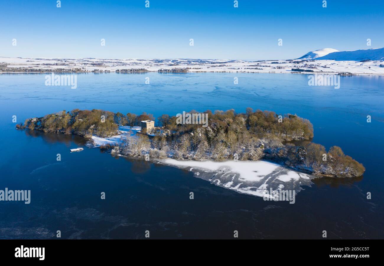 Aerial view of a snow covered Lochleven Castle situated on small loch on Loch Leven, Kinross-shire. Stock Photo
