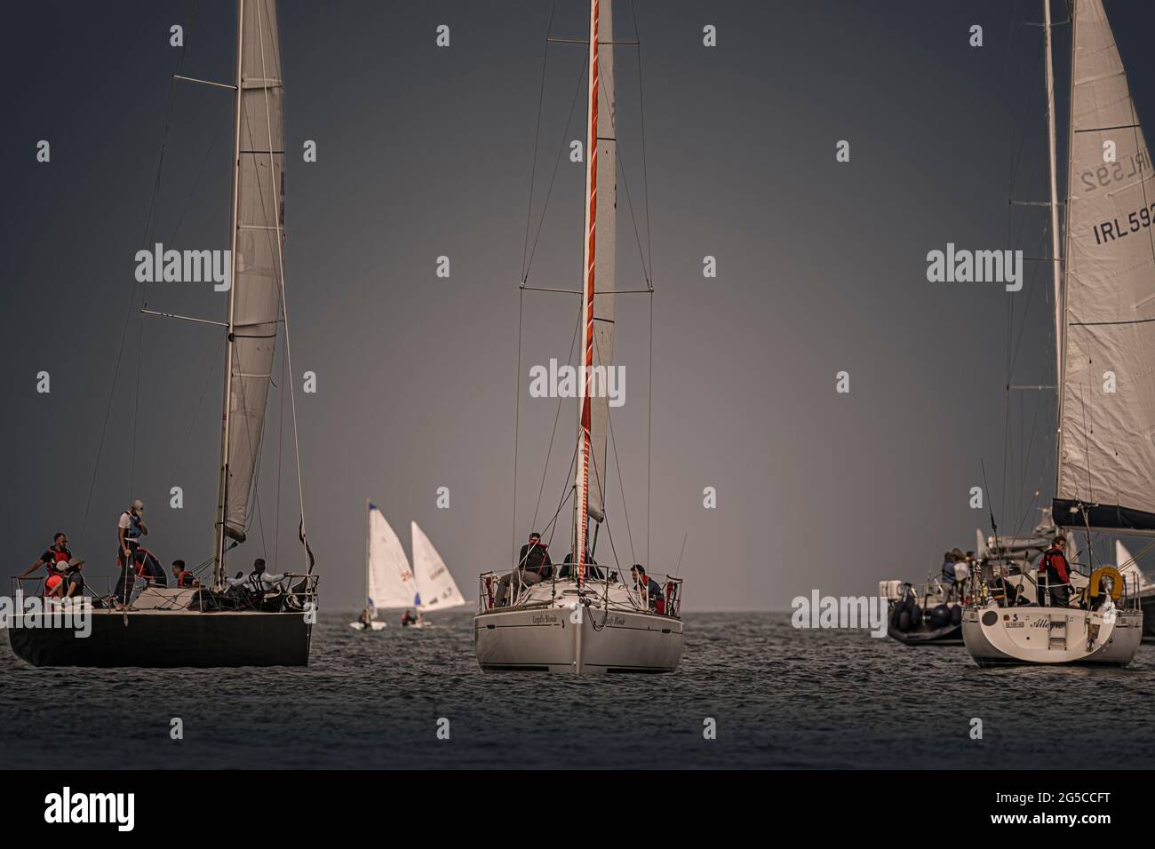 Sailing together. Group of sailboats sails during sail club regatta near Greystones, Irish sea