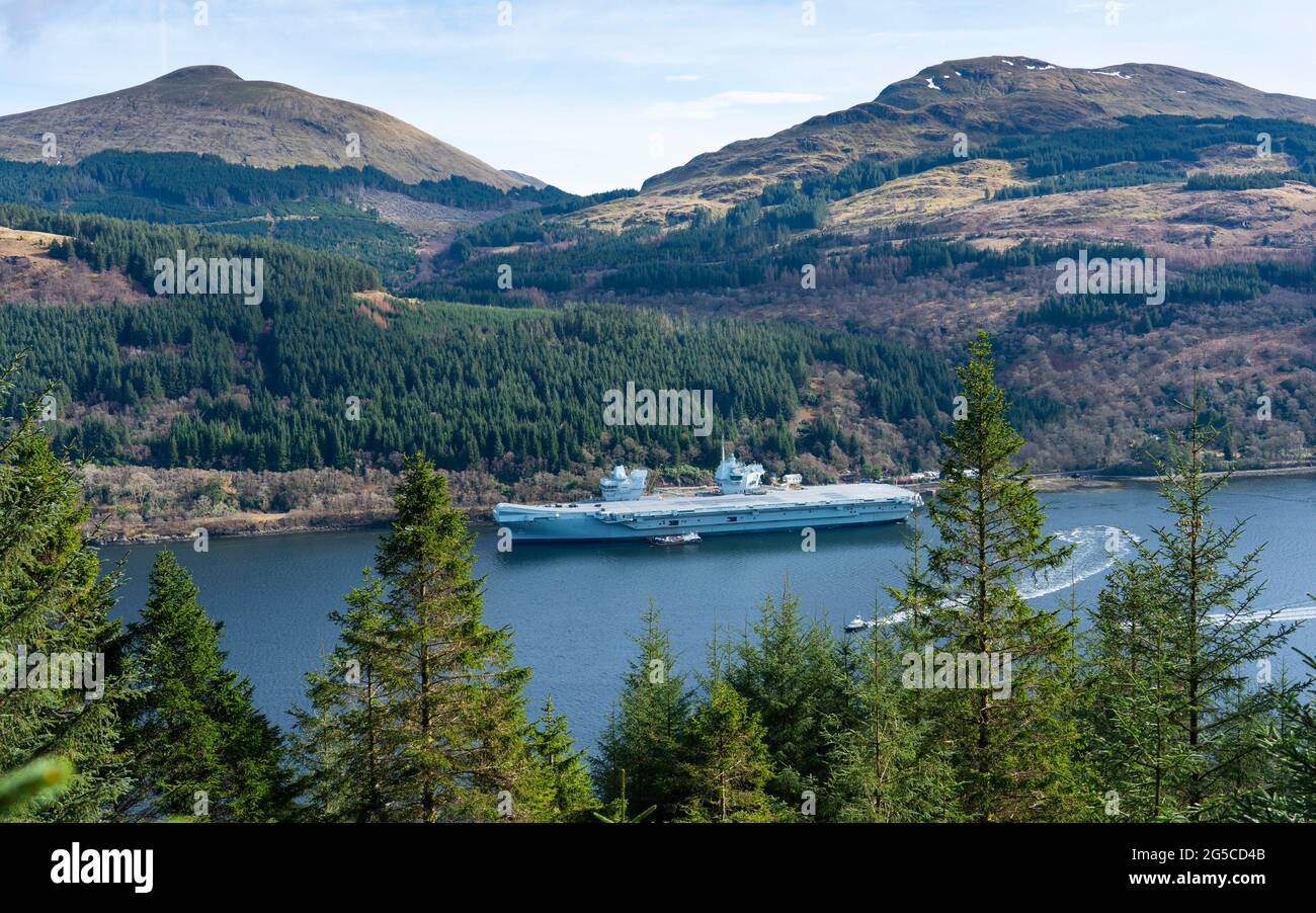 The aircraft carrier HMS Queen Elizabeth berthed on the side of Loch Long at Glenmallon, Argyll and Bute, Scotland, UK Stock Photo