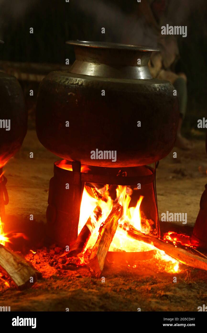 Traditional Cambodian Khmer Wedding Food for a Feast Cooking over Fires at Night Stock Photo