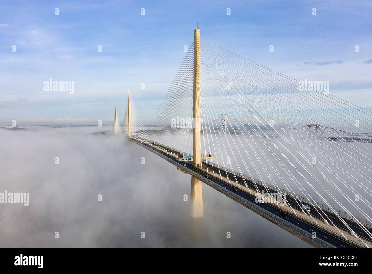 Drone image of a spectacular cloud inversion at Queensferry Crossing Bridge with lower half covered in mist, South Queensferry , Scotland, UK Stock Photo