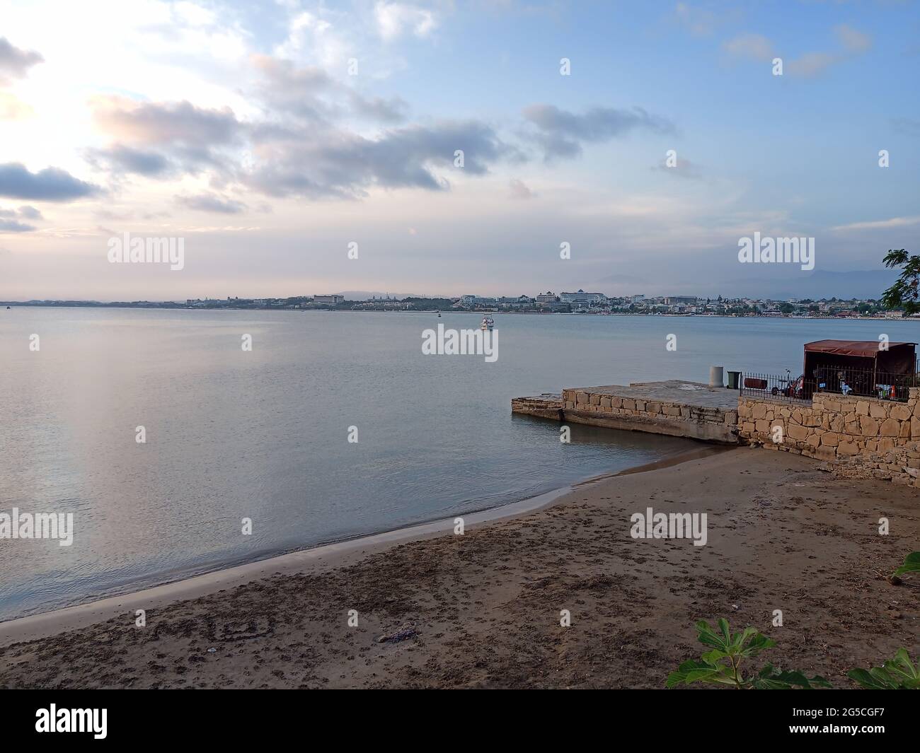 Sandy beach of a sea with a blue sky Stock Photo - Alamy