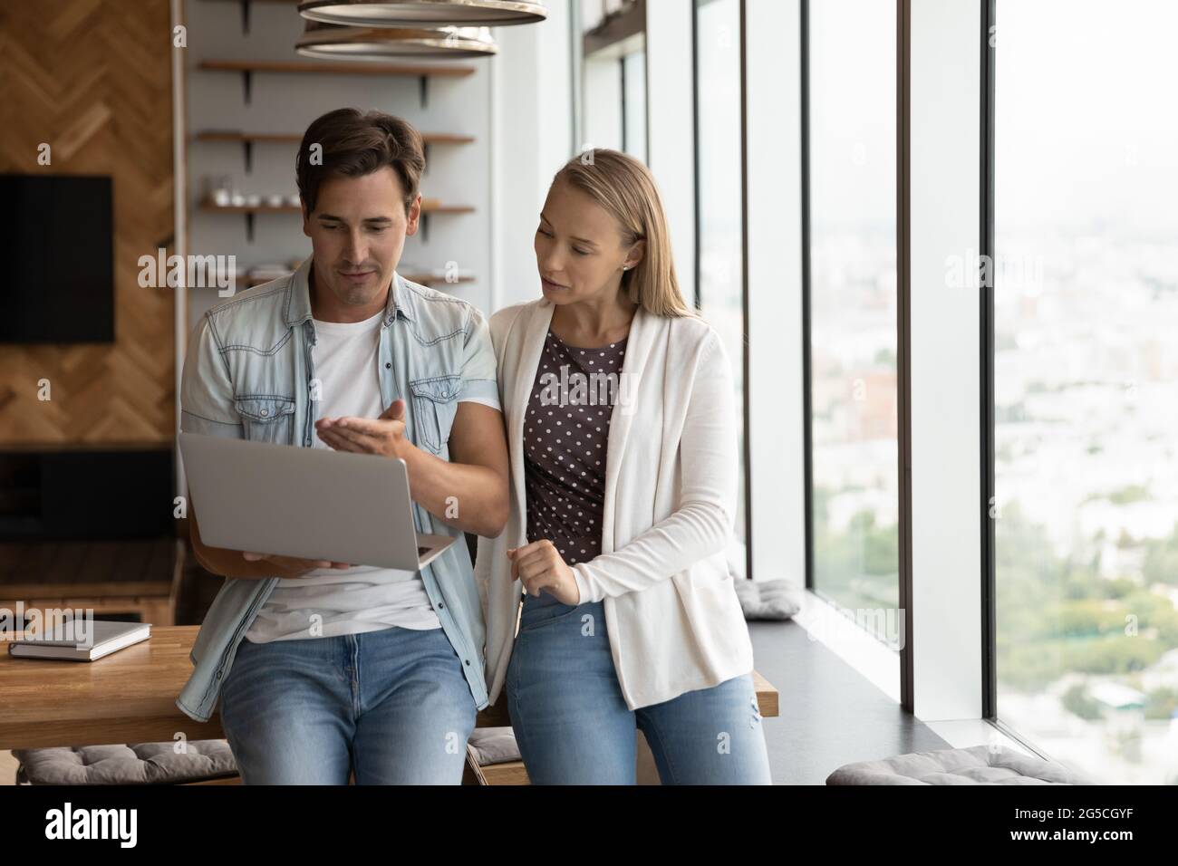 Concentrated young employees working on online computer project. Stock Photo