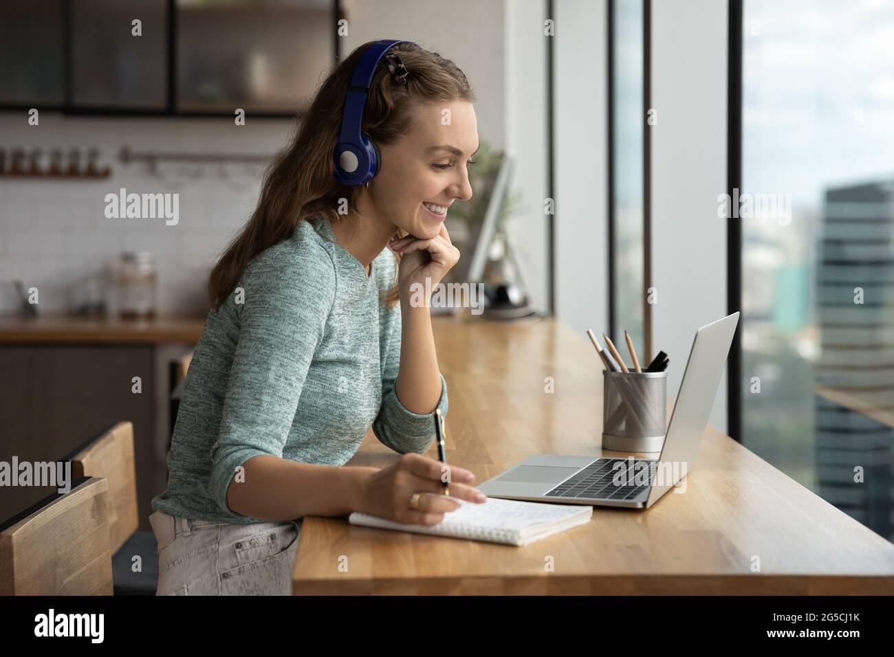 Smiling beautiful woman holding video call conversation Stock Photo - Alamy