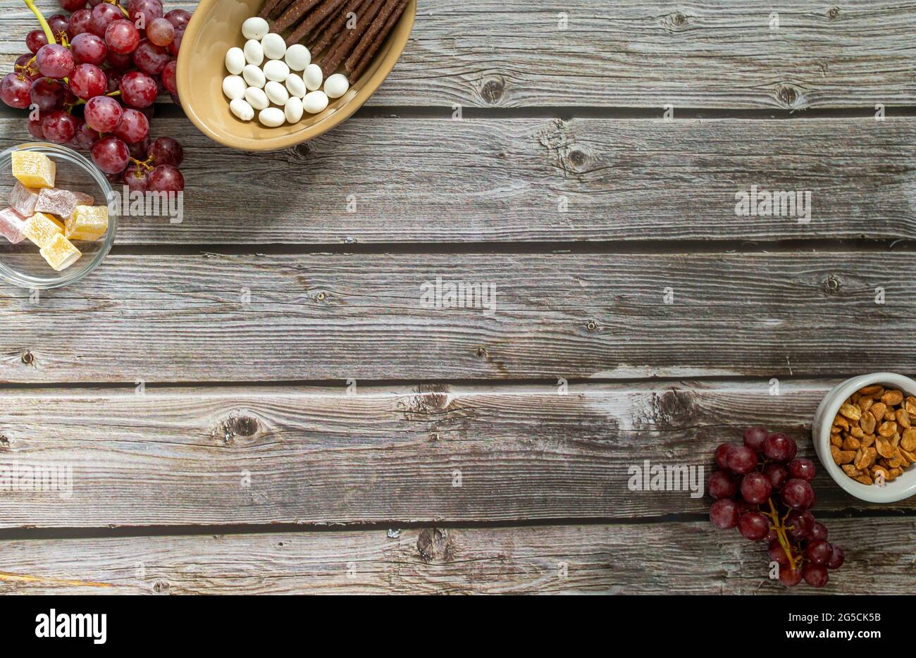 wooden table top background with snack foods and copy space Stock Photo