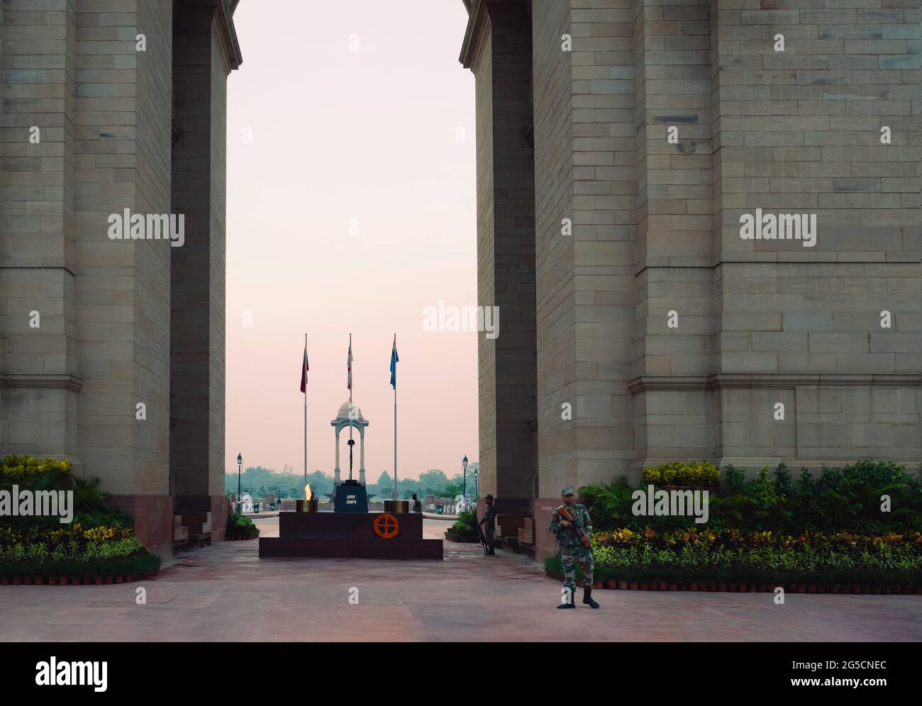 Indian army guards on alert in front of India Gate, World War 2 memorial, in Delhi, India. Stock Photo