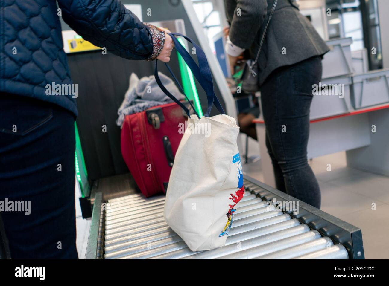 the xray scan in the airport terminal, checking the bags with luggage