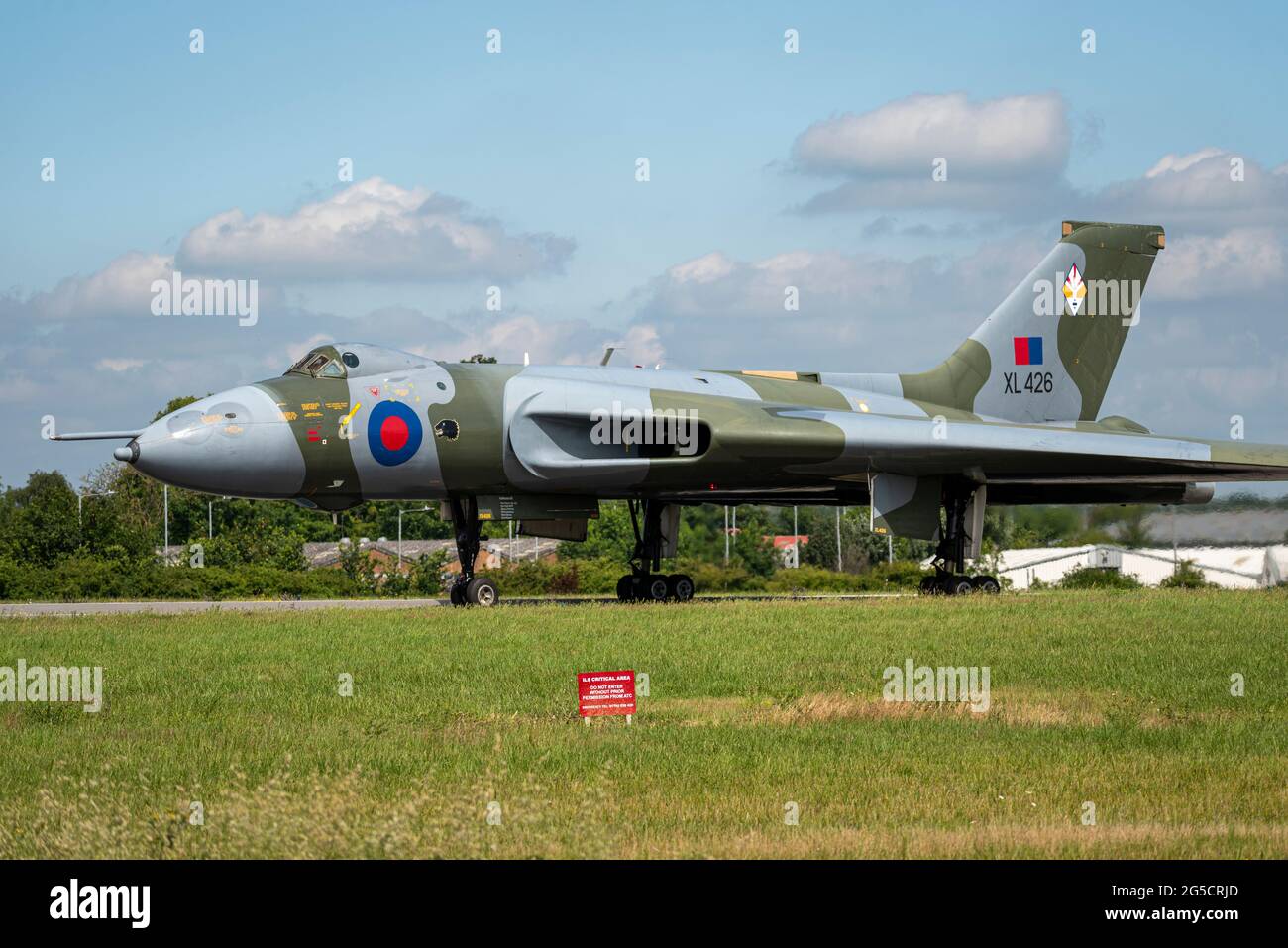 London Southend Airport, Essex, UK. 26th Jun, 2021. A former Royal Air Force Cold War Avro Vulcan B2 bomber has been run down the runway at Southend Airport for an Armed Forces Day event. The aircraft, serial number XL426, was retired from the RAF in 1986 and has since been restored to ground running condition by the Vulcan Restoration Trust charity. The charity is entirely public donation funded and saw a COVID-limited number of paying guests inside the airport, whilst people watched from outside. The Trust's operation and engineering teams are all volunteers Stock Photo