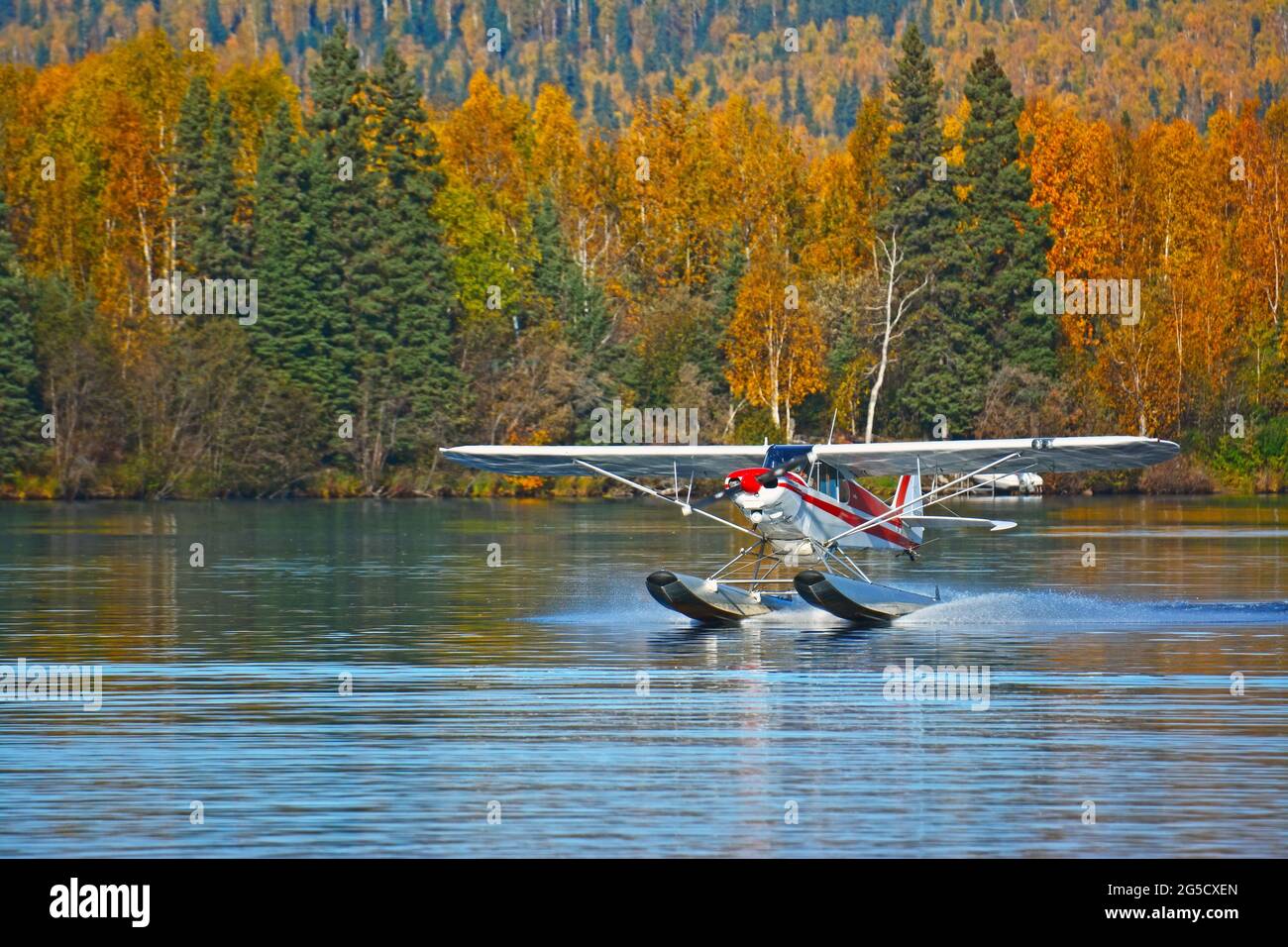 A bush plane lands in Alaskan lake Stock Photo Alamy